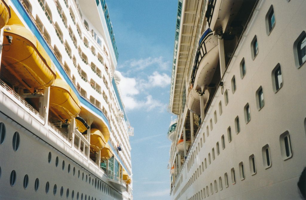Two large white cruise ships